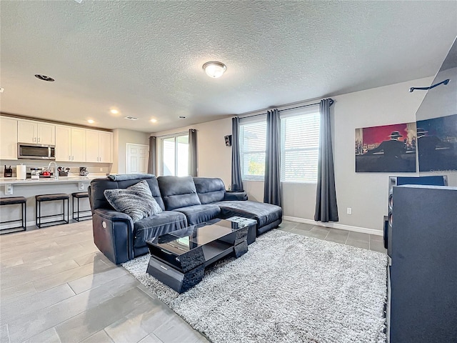 living room featuring a textured ceiling