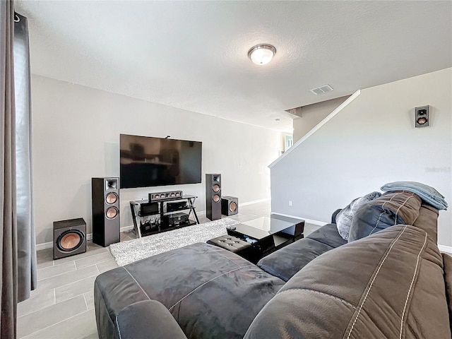 living room with a textured ceiling