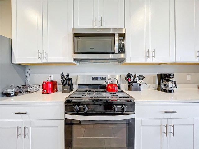 kitchen featuring white cabinets and stainless steel appliances