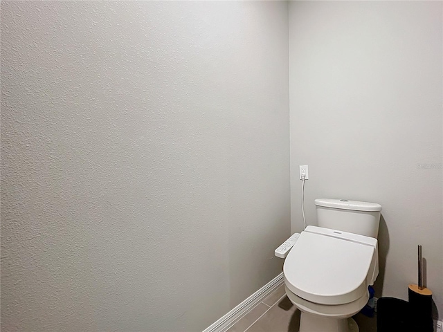 bathroom featuring tile patterned floors and toilet