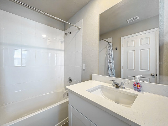 bathroom featuring vanity and shower / bath combo with shower curtain