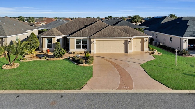 ranch-style home with a garage and a front yard