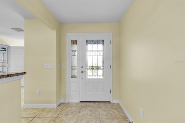 entryway featuring light tile patterned floors