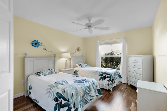 bedroom with ceiling fan and dark hardwood / wood-style flooring