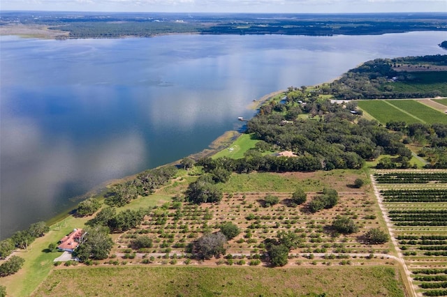 drone / aerial view featuring a water view and a rural view