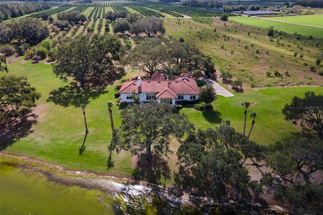 drone / aerial view featuring a water view and a rural view