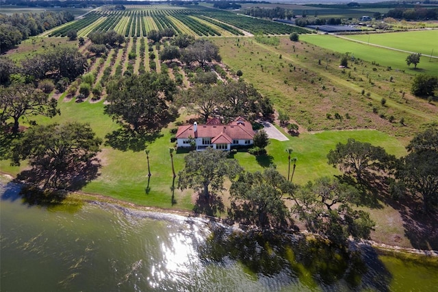 drone / aerial view featuring a water view and a rural view