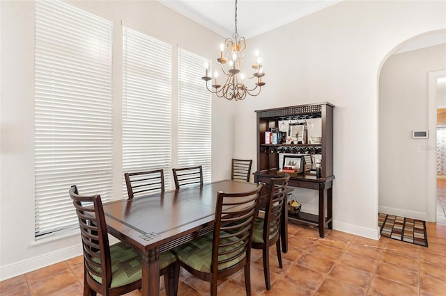 dining room featuring light tile patterned floors and a chandelier