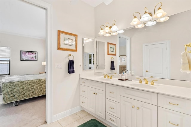 bathroom featuring tile patterned flooring, vanity, and a chandelier