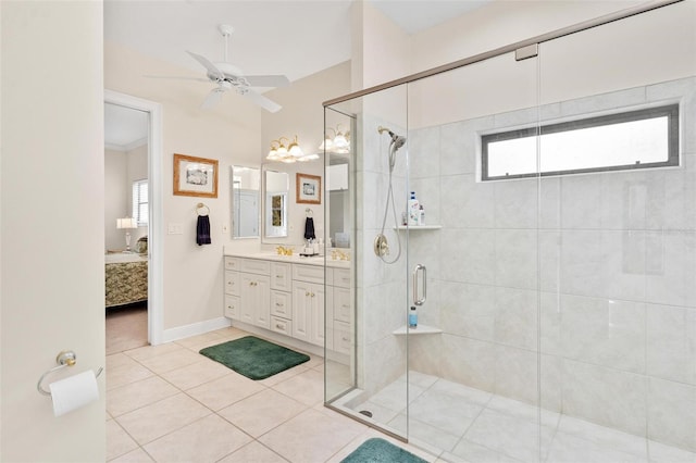 bathroom with tile patterned floors, vanity, ceiling fan, and walk in shower