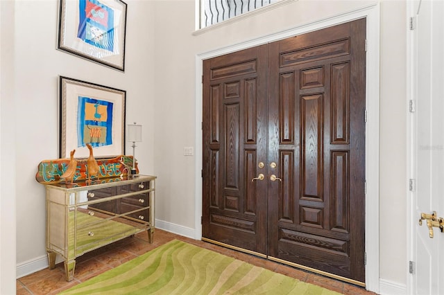 foyer entrance with tile patterned floors