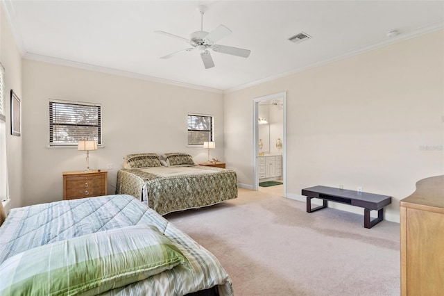 bedroom featuring crown molding, light colored carpet, ceiling fan, and ensuite bath