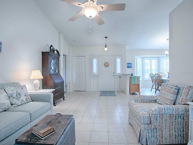 tiled living room featuring ceiling fan