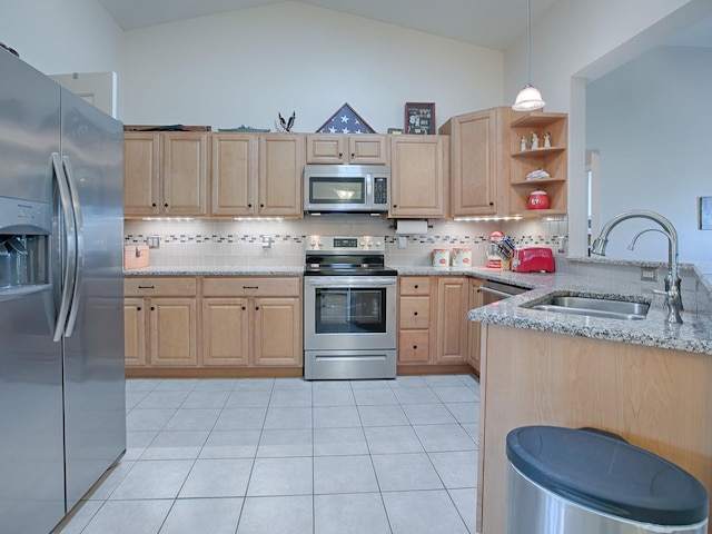 kitchen with pendant lighting, light brown cabinets, sink, and appliances with stainless steel finishes