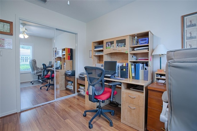 office space with ceiling fan, light hardwood / wood-style floors, and a textured ceiling