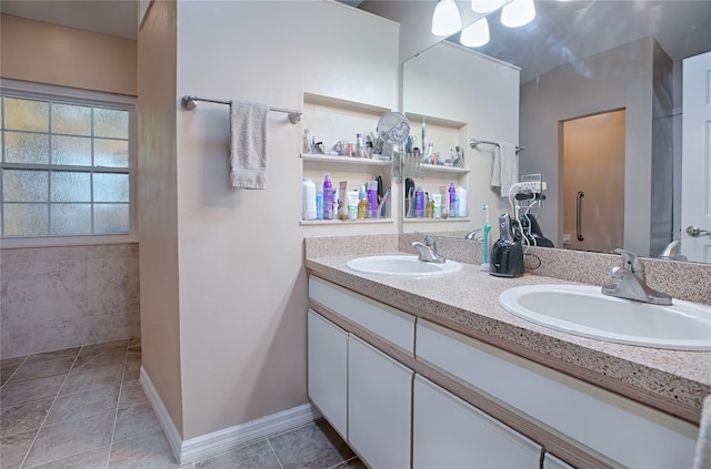 bathroom with tile patterned flooring and vanity