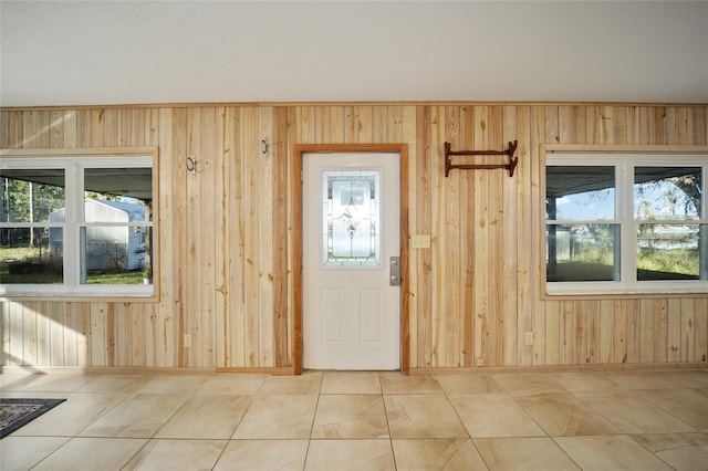 entrance foyer featuring wood walls