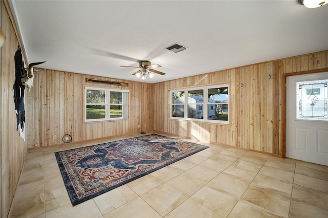 10285 NE 218th Lane Rd, Fort Mc Coy, FL 32134 - foyer entrance featuring wood walls and a ceiling fan