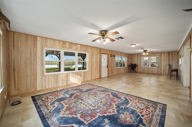 10285 NE 218th Lane Rd, Fort Mc Coy, FL 32134 - unfurnished living room with ceiling fan and wooden walls