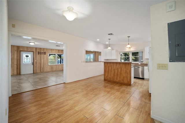 10285 NE 218th Lane Rd, Fort Mc Coy, FL 32134 - kitchen featuring dishwasher, electric panel, white cabinets, light wood-style flooring, and open floor plan