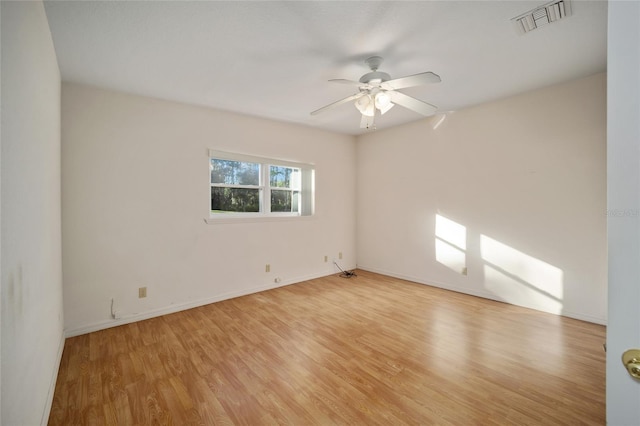 unfurnished room featuring ceiling fan and light hardwood / wood-style floors