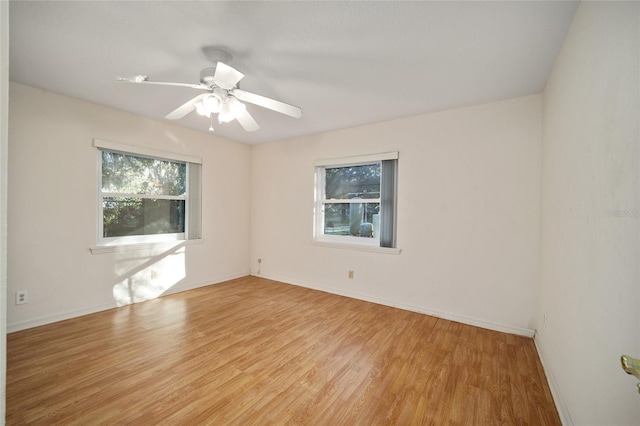 spare room with light hardwood / wood-style floors and ceiling fan