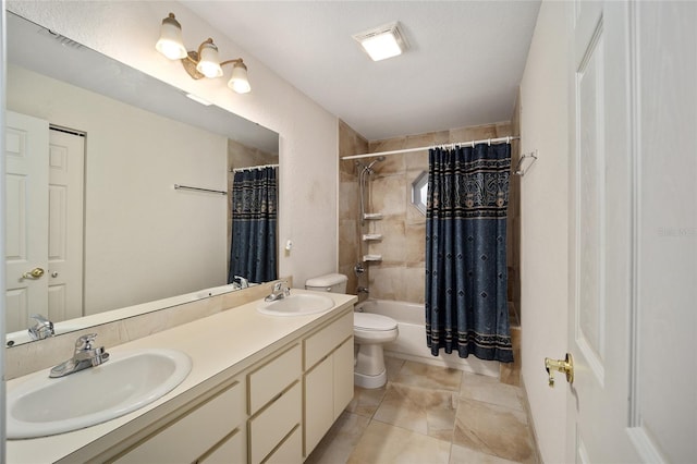 full bathroom with tile patterned flooring, shower / bath combo with shower curtain, vanity, and toilet