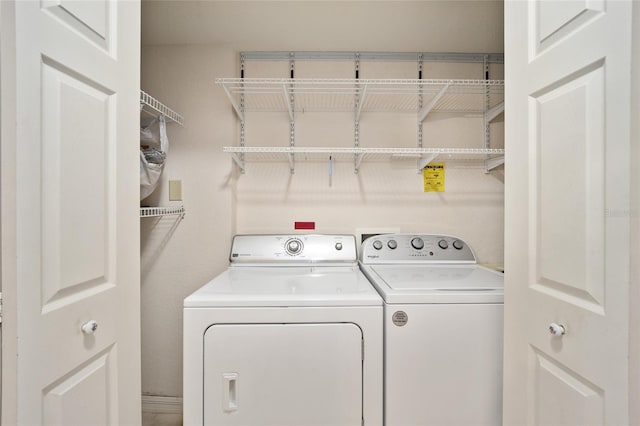 laundry room with washer and dryer