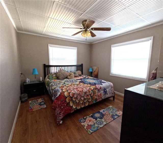 bedroom featuring ceiling fan, ornamental molding, and hardwood / wood-style floors