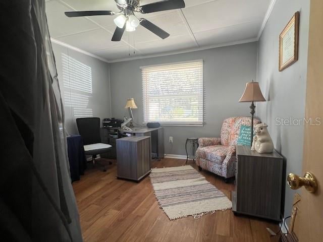 office space with hardwood / wood-style flooring, ceiling fan, and crown molding