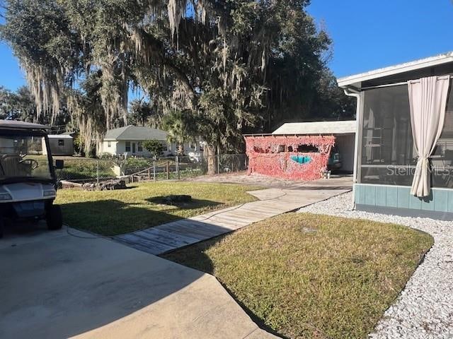 view of yard with a sunroom