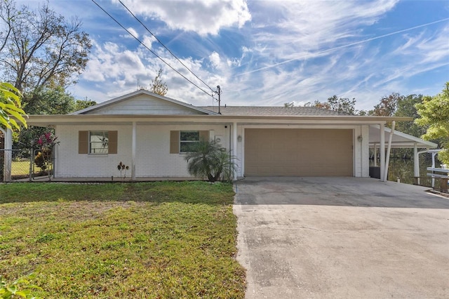 ranch-style home featuring a garage and a front yard