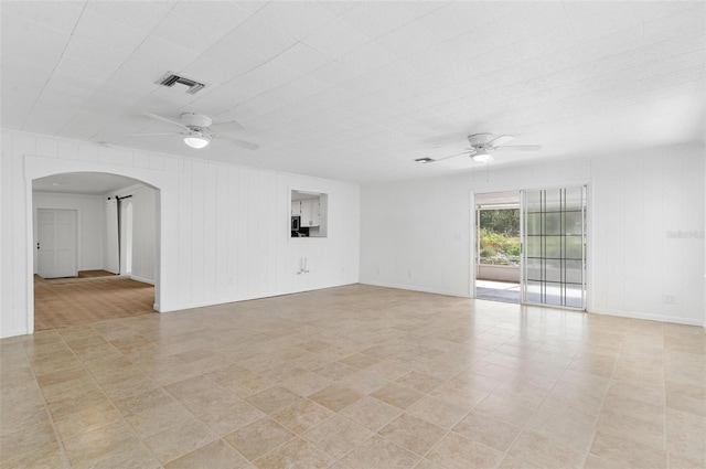 unfurnished room featuring ceiling fan and light tile patterned flooring