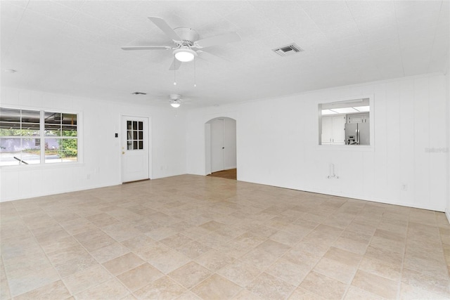 unfurnished room with ceiling fan