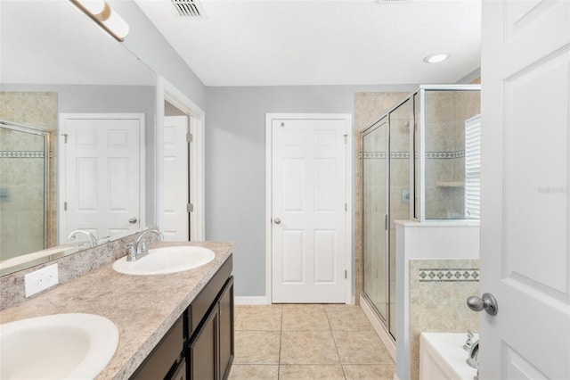 bathroom with tile patterned floors, vanity, and plus walk in shower