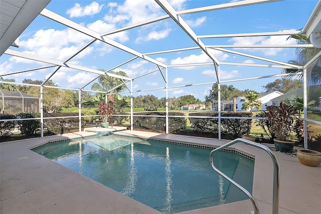 view of pool featuring glass enclosure