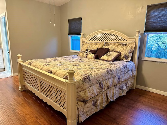 bedroom featuring dark hardwood / wood-style flooring