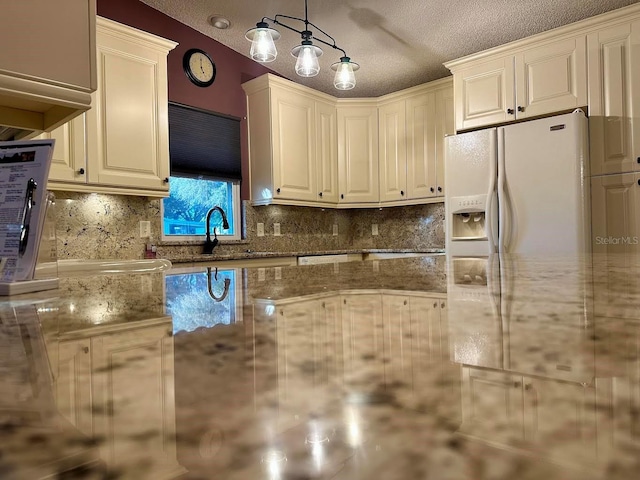 kitchen with light stone countertops, sink, a textured ceiling, decorative light fixtures, and decorative backsplash