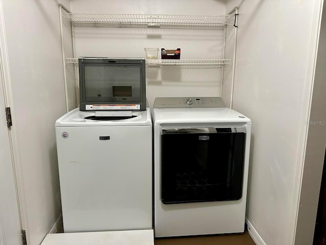 washroom with washer and dryer