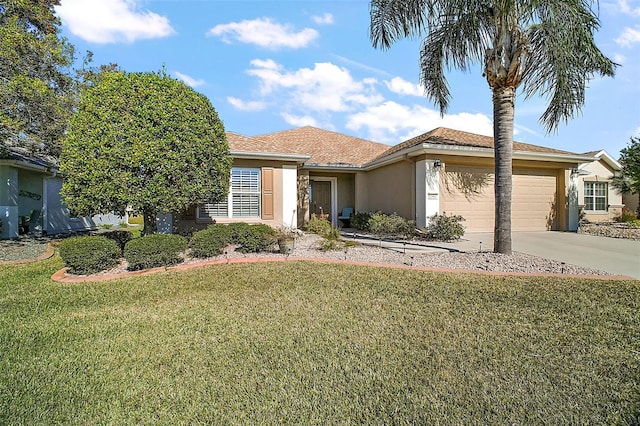 view of front of house with a front lawn and a garage