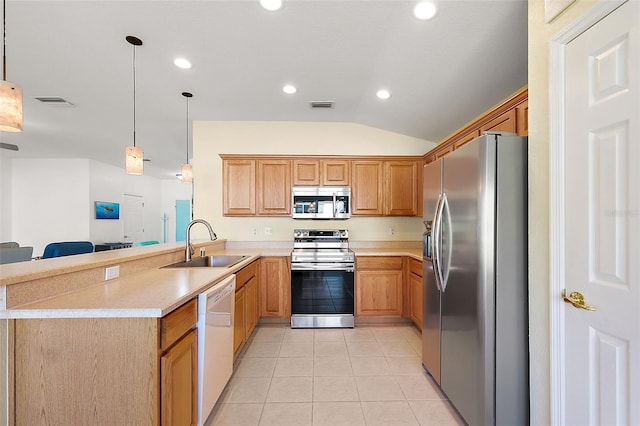 kitchen featuring sink, hanging light fixtures, stainless steel appliances, kitchen peninsula, and lofted ceiling