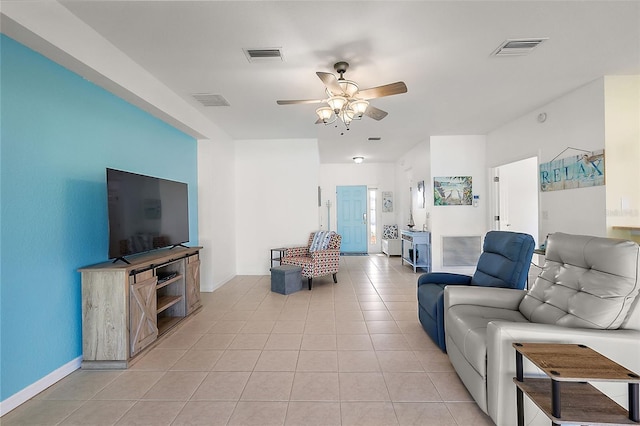 living room with light tile patterned floors and ceiling fan