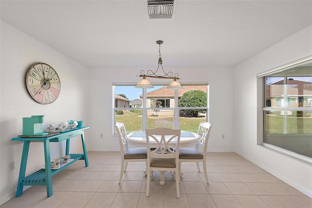 dining area with light tile patterned floors