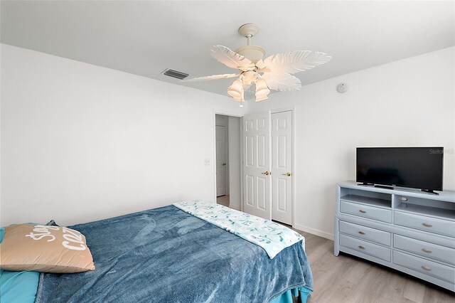 bedroom with ceiling fan and light wood-type flooring