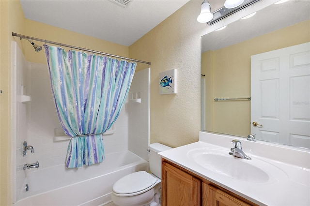 full bathroom featuring toilet, vanity, and shower / tub combo with curtain