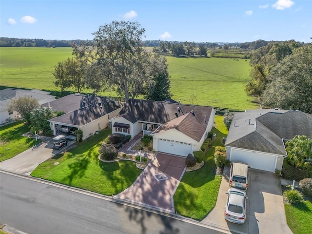 birds eye view of property featuring a rural view