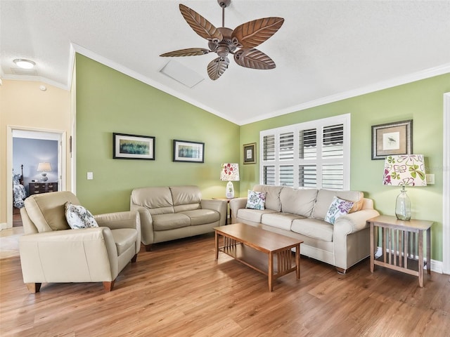 living room with a textured ceiling, ceiling fan, crown molding, light hardwood / wood-style floors, and lofted ceiling