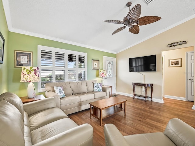 living room with crown molding, hardwood / wood-style floors, ceiling fan, and lofted ceiling