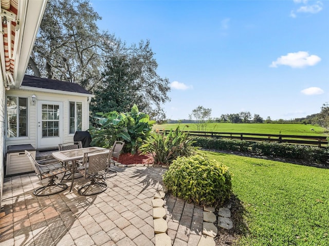 view of patio / terrace with a rural view