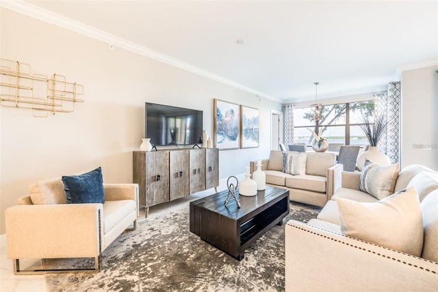 living room with an inviting chandelier and ornamental molding